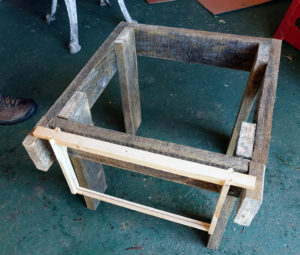 They make their own hive stands from scrap wood.
